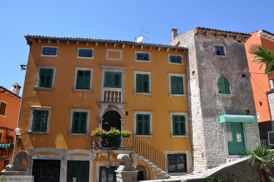 Colourful façades beside the stone pavement