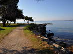 Pošesi - Gravel track beside low rocks 