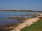 Medulin - Pošesi <br> Long low shore with rock ridges in the water 