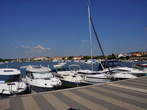 Harbour - Sailing boats beyond the low harbour wall 