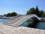 Kastel - Pedestrian bridge in front of the complex 