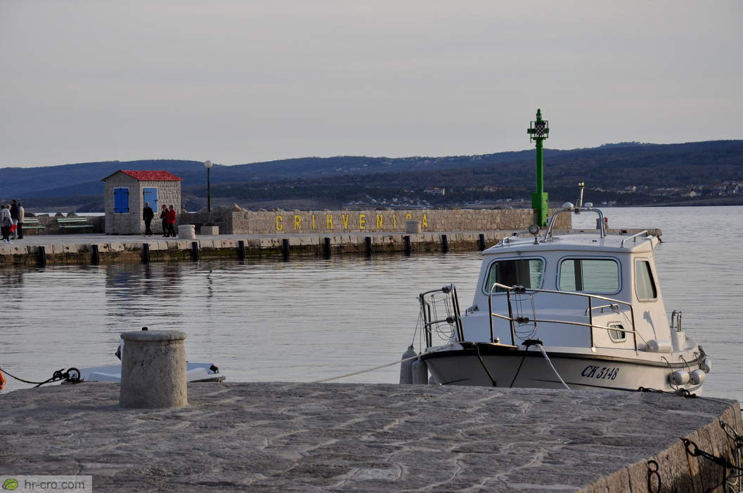 Green beacon at the harbour entrance