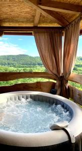 Holiday home with hot tube, near the river